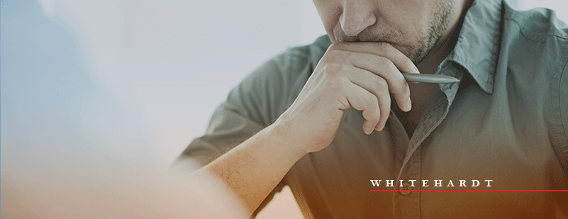 Business Owner Browsing The Web While In Deep Thought Stock Photo